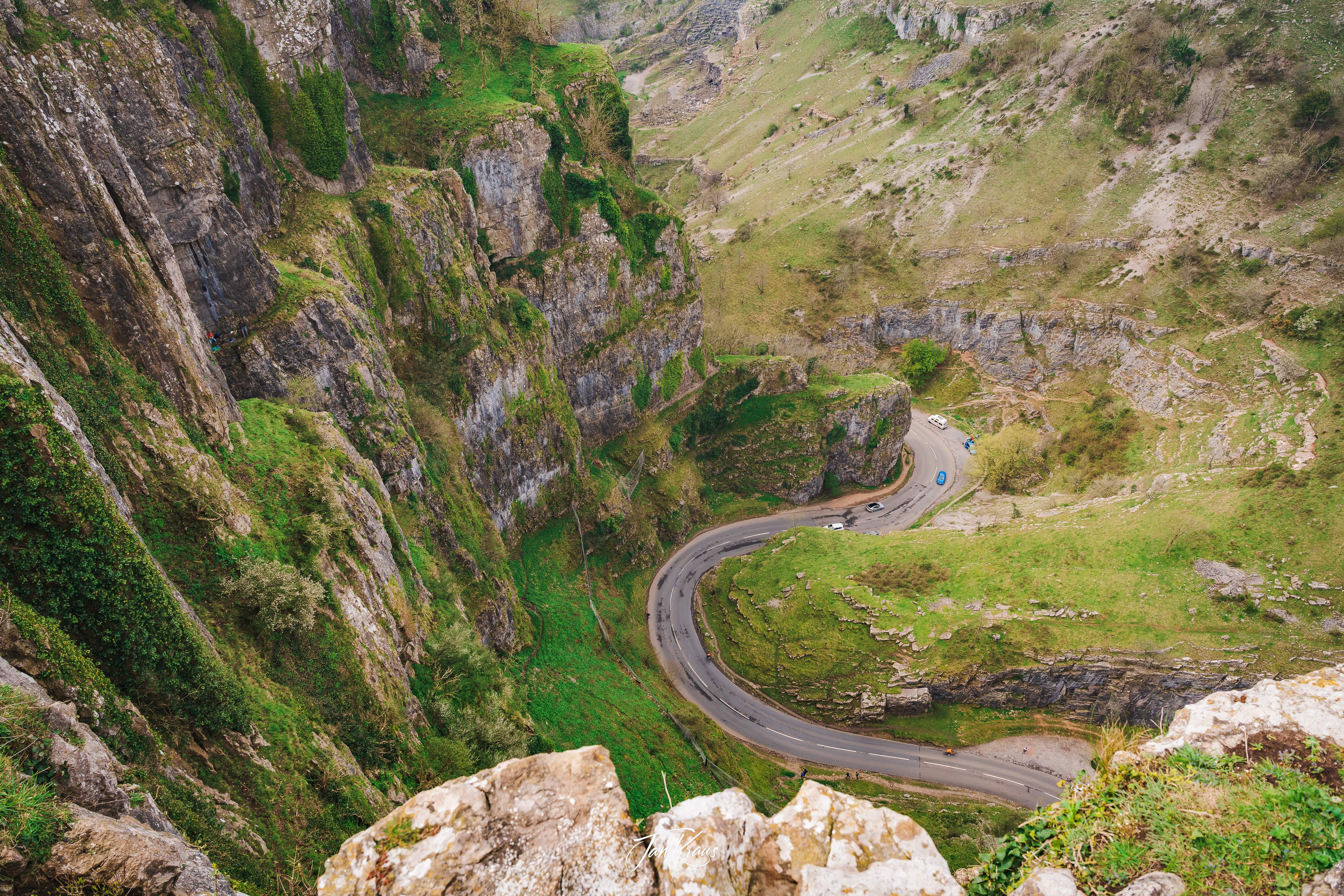 View over the B3135 road from the clifftops of Cheddar Gorge, facing the Cheddar Village, Somerset, England, UK