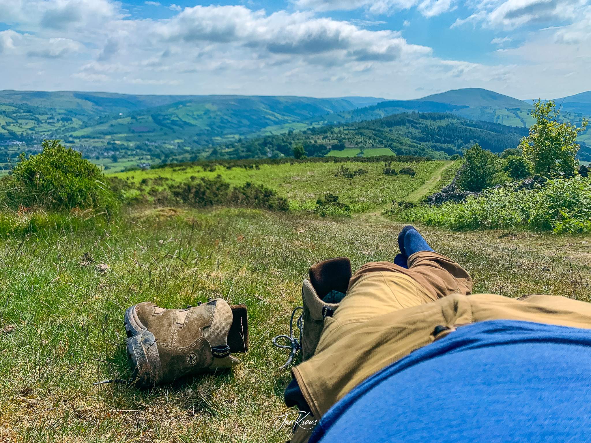Resting after reaching Cefn Moel, Day 3 of the Beacons Way hike, Wales, UK