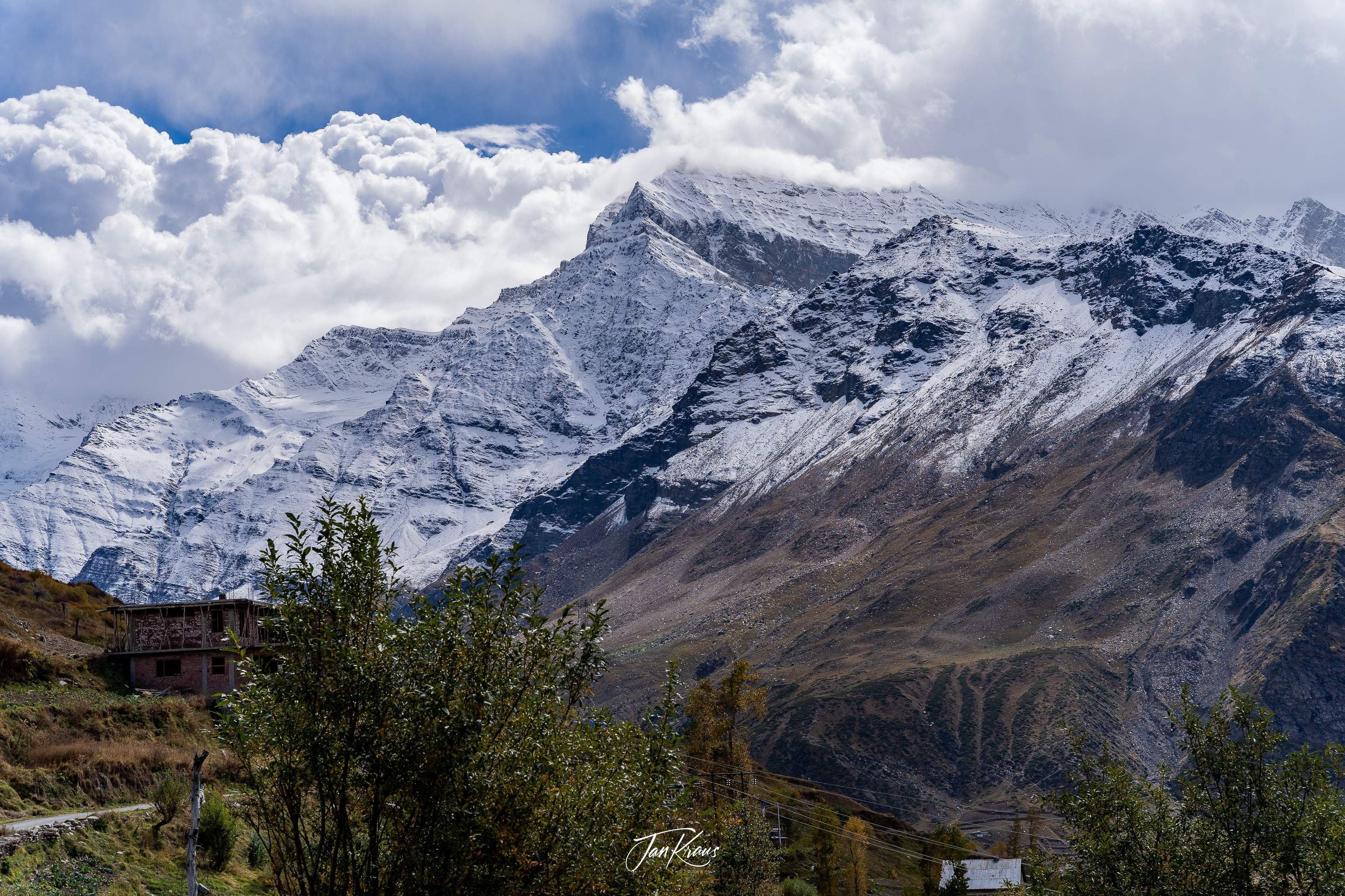 Snow covered peaks seen in Kullu Valley, India
