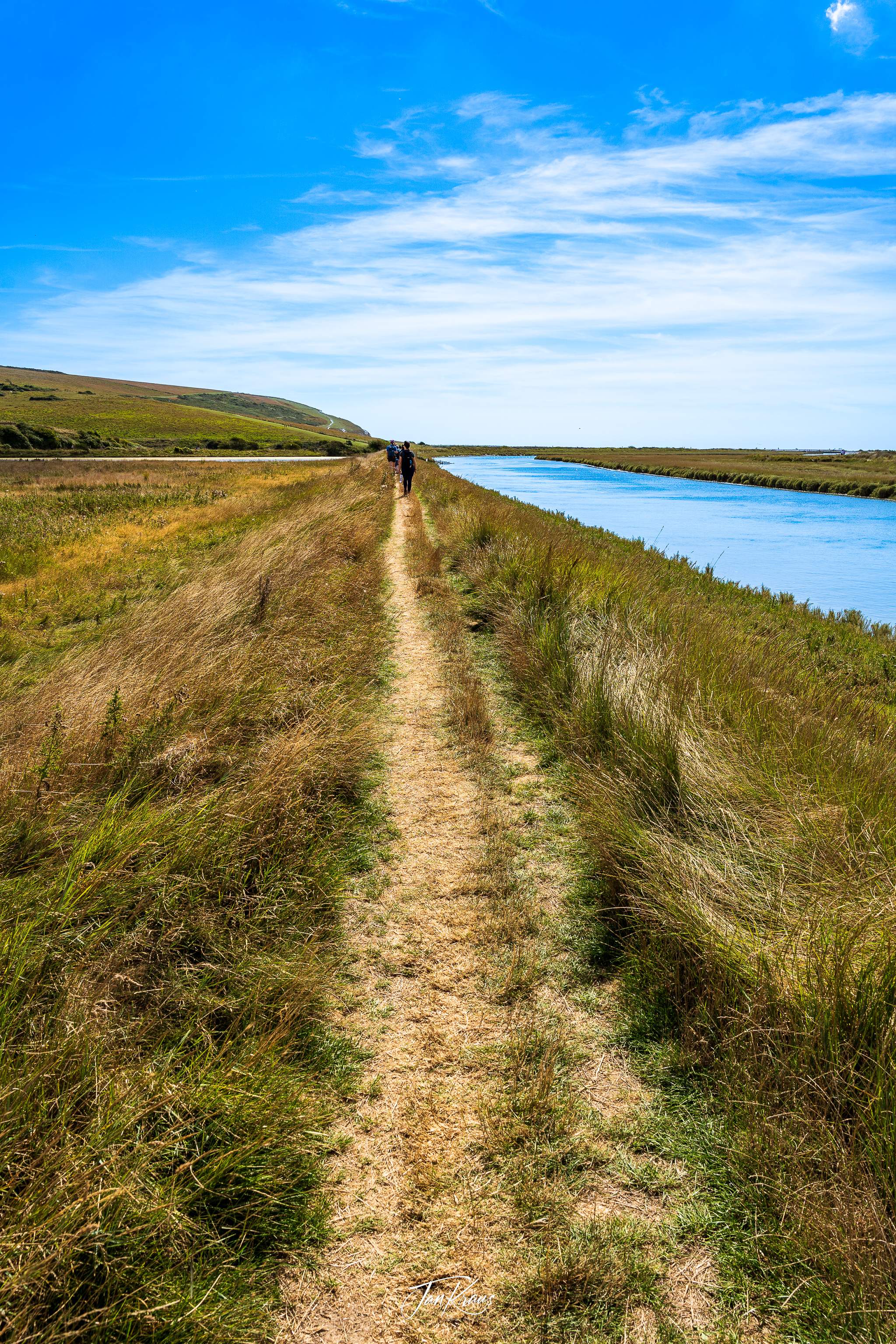 Path along the Cuckmere River, East Sussex, England, UK
