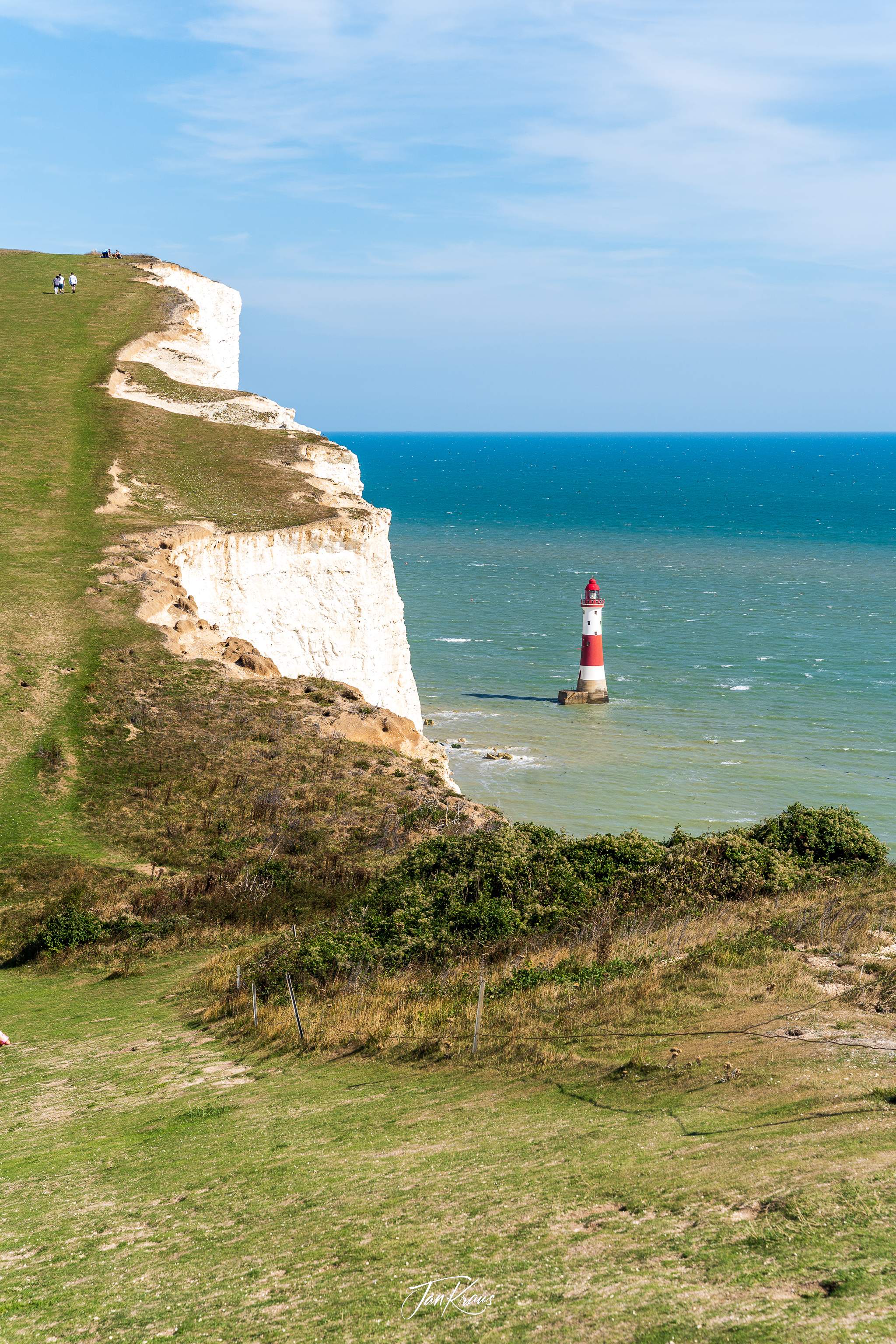 A brightly painted lighthouse at the Birling Gap, East Sussex, England, UK